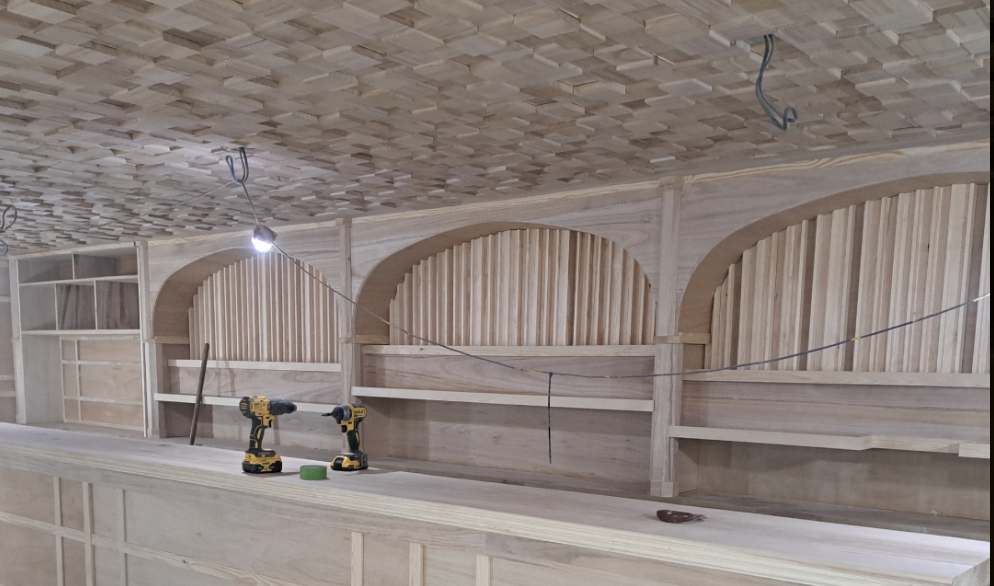 Acoustic materials and production components being prepared in a workshop.